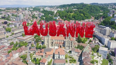 Inscription on video. Lausanne, Switzerland. Cathedral of Lausanne. La Cite is a district historical centre. Flames with dark fire, Aerial View, Departure of the camera