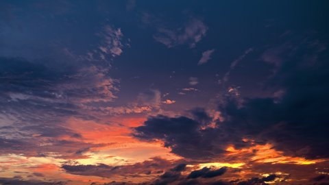 Magnificent sky clouds nature landscape at sunset. Colorful clouds move on the blue sky. 4k sky sunset clouds time lapse.
