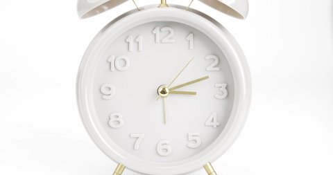 Vintage alarm clock over isolated on white background, Showtime 03.12 am or pm.