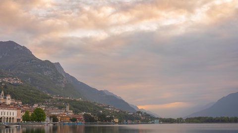 Timelapse of Lake Iseo at sunrise, on the left the city of lovere which runs along the lake,Bergamo Italy.