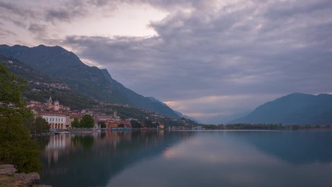 Timelapse of Lake Iseo at sunrise, on the left the city of lovere which runs along the lake,Bergamo Italy.