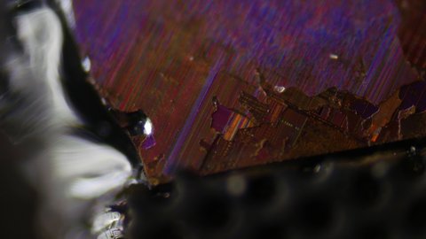 Artifact of an advanced civilization. Archaeological excavations and research. Piece of a 21st century processor under a microscope. The basis of silicon life of mankind