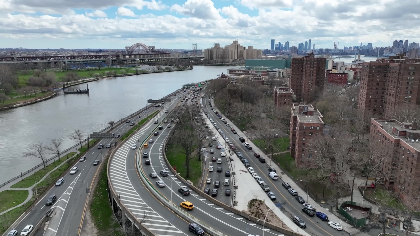 NYC, USA - APRIL 14, 2022: aerial cars driving in traffic East Harlem River Drive FDR in New York City.