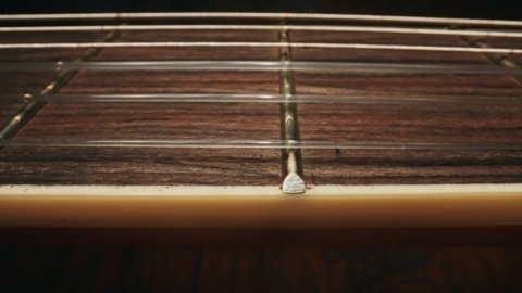Classical fretboard six-string electric guitar.