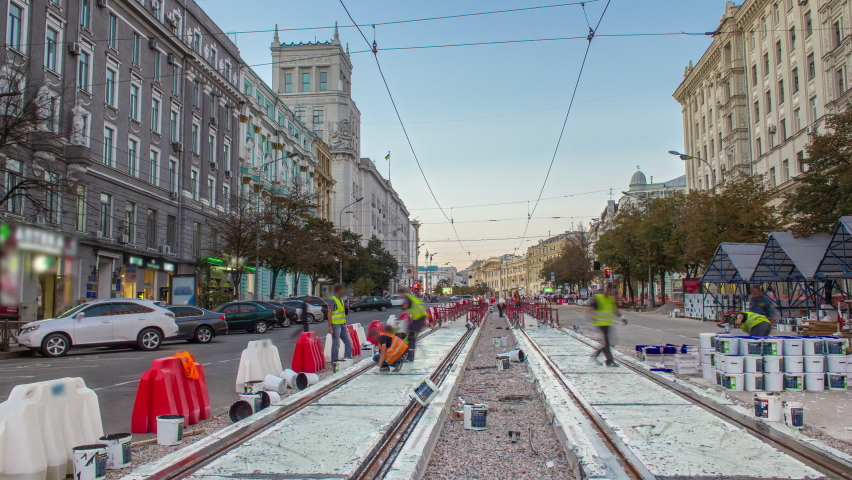 Tram rails at the stage of their integration into concrete plates on the road timelapse. Filling by liquid resin for reduction of vibration and noice. The process of reconstruction of tram tracks in