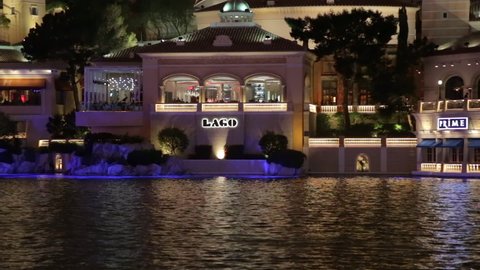 Las Vegas, USA - January 2016 :  Pond and exterior view of the Lago restaurant of the Bellagio hotel at night on the Las Vegas strip in Nevada, US