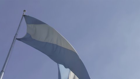 Flag of Argentina Against Blue Sky. Close Up. 4K Resolution.