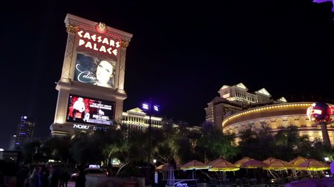Las Vegas, USA - January 2016 : Caesars Palace hotel and casino facade at night with a display of the Celine Dion music show in Nevada, United States