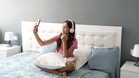 communication online of happy kid wearing headphones in bedroom, online communication - Powered by Shutterstock - Get 15% off with code: PIKWIZARD15