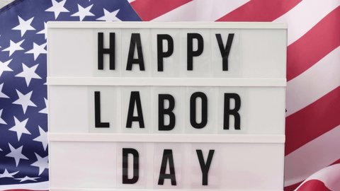 4k Waving American Flag Background. Lightbox with text HAPPY LABOR DAY Flag of the united states of America. July 4th Independence Day. USA patriotism national holiday. Usa proud.
