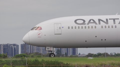Sydney, Australia - Mar 26, 2022: Close-up view of Qantas airplane on runway of Sydney Airport
