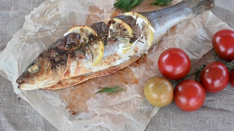 Grilled sea bass fish with sauces and vegetables. Tasty food concept