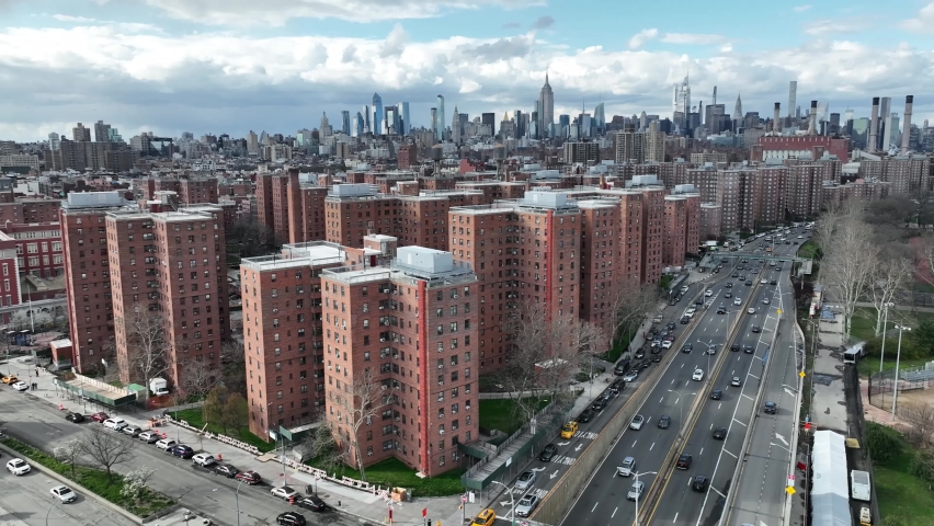 NYC, USA - APR 14, 2022: aerial cars driving in Lower East Side LES projects Manhattan skyline in New York City.