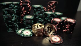 Rotation of the camera over a bitcoin coin against the background of casino playing chips. Bitcoin casino game. Cryptocurrency excitement. Bet on bitcoins. - Powered by Shutterstock - Get 15% off with code: PIKWIZARD15