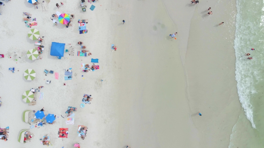 Top down view of people in a white sand beautiful beach in Clearwater, Florida