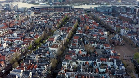 Aerial View of Old Centre district of Amsterdam, Netherlands on cloudy morning 4K