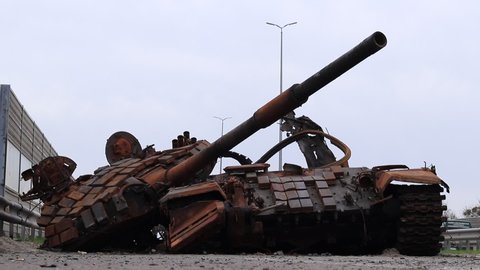Ukraine, Kalynivka, Kyiv Oblast - 04.25.2022: Broken burnt tank. Destroyed military equipment. Consequences of Russia's invasion of Ukraine