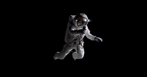 Caucasian female astronaut using her mobile phone during spacewalk, messaging, taking pictures Video de stock