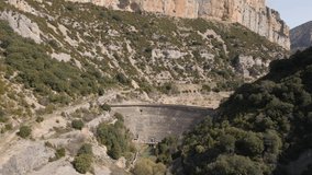 Video in 4k resolution in the Natural Park of Sierra y Cañones de Guara, Pyrenees of Aragon, reservoir of Santa María de Belsue in Huesca, an aerial trip over the forests and rivers of the Spanish 