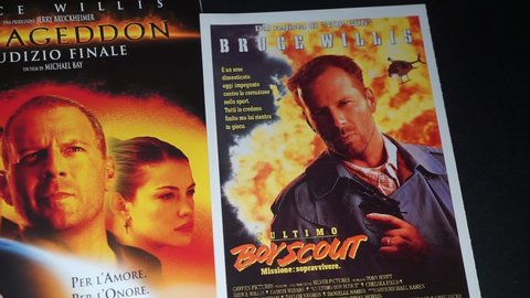 Rome, Italy - April 01, 2021, detail of the cover of the film Armageddon - Final Judgment and the postcard of the movie poster of the film The last boy scout, Mission to survive.