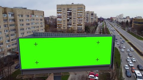 Billboard near the road with a green background to replace the picture. Marketing and advertising in the city – Video có sẵn