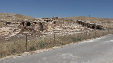 Dara, Mardin, Turkey - 16th of June 2021: 4K Excavations of the ancient Dara town behind fence
