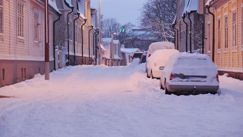 View of the Puu Vallila neighborhood in the snowy winter. It is the wooden houses old neighborhood in central Helsinki, Finland.