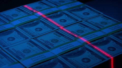 Security Laser Scans Large Block Of Money