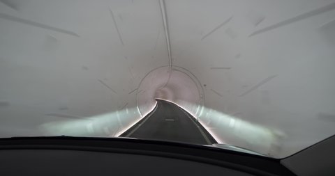 LAS VEGAS - Circa April, 2022 - A front seat passenger's view riding in a Tesla car under the convention center through the Vegas Loop tunnels.  	