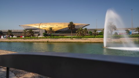 Dubai, United Arab Emirates - October 18 2021: Mall of the Emirates metro station in Dubai with a small lake and fountain in front