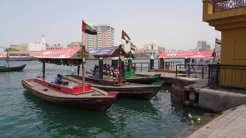 Dubai, United Arab Emirates. April 17, 2022. The abras are traditional boats made of wood. Abras are used to ferry people across the Dubai Creek. Boats waiting for passengers at the departure pier