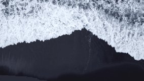 Black sand beach and foam waves. View from the top. Look like Space. holidays in Canary Islands. static and movement. 

videos