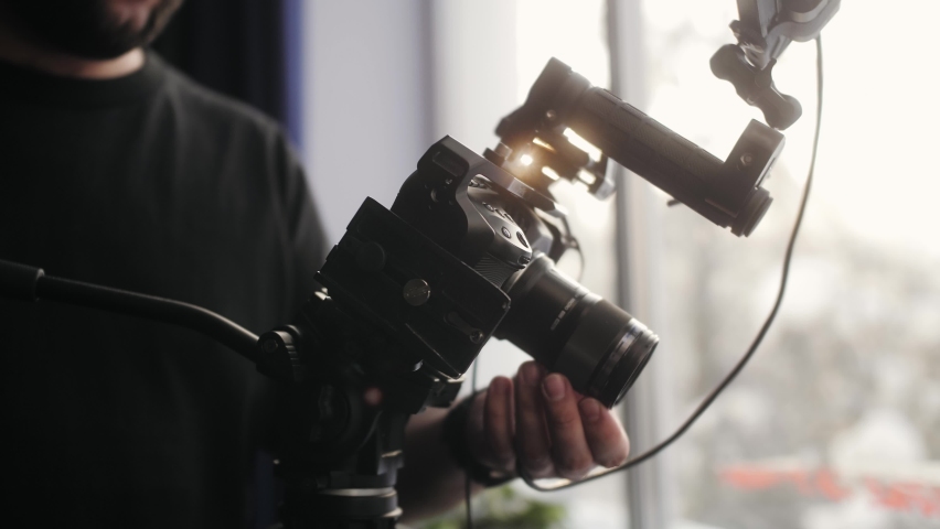 Video production backstage. Professional camera man creating video content in studio, commercial filming. Royalty-Free Stock Footage #1089675849