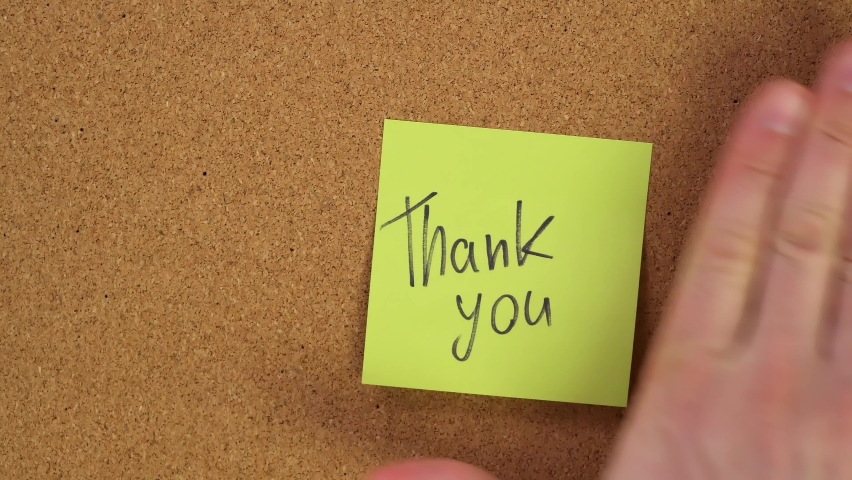 thank you, thanks Stick the sticker on the cork board. Top view of note board. Wall of records in the office. Leave a reminder at work or at home. Caucasian male hand sticks and unsticks paper. - Powered by Shutterstock - Get 15% off with code: PIKWIZARD15