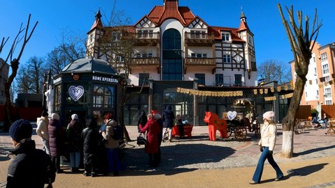 Kaliningrad, Russia,22, February, 2022:
Line of people at the kiosk with coffee and pastries in winter