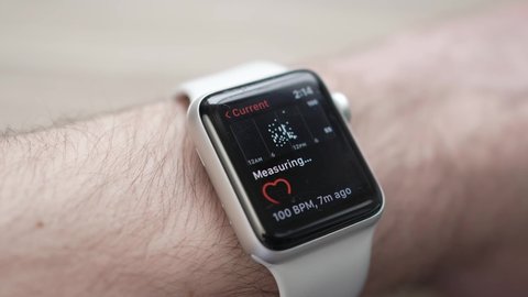 Apple watch monitors the heartbeat and shows the pulse while sitting on the wrist of the user. MONTREAL CANADA APRIL 2022