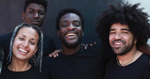 Group of young multiracial people smiling on camera