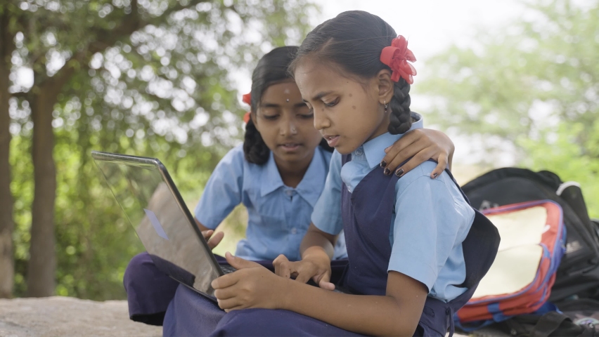 handheld shot of Village school girl kids seriously busy working on laptop - concept of education, technology and knowledge Royalty-Free Stock Footage #1089682729