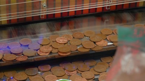 Pennies Drop Onto A Shelf Coin Penny Pusher Solt Machine In An Arcade Casino