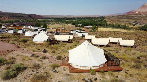 Canvas Tents, Covered Wagons And Luxury Private Bungalows At Zion Wildflower Resort In Zion National Park, Utah. - aerial ascend