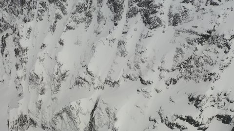 Dramatic aerial view of snowy cliffs on the north face of Mt Currie, Pemberton - British Columbia, Canada