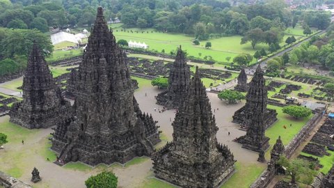 Hindu temple Prambanan in Yogyakarta, Indonesia during humid conditions, Aerial pedestal rising shot