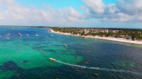 Boats and yachts in Caribbean sea, Bavaro resort in Punta Cana, Dominican Republic, aerial drone view