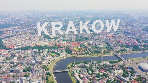 Inscription on video. Krakow, Poland. Wawel Castle. Ships on the Vistula River. View of the historic center. Glitch effect text, Aerial View, Departure of the camera