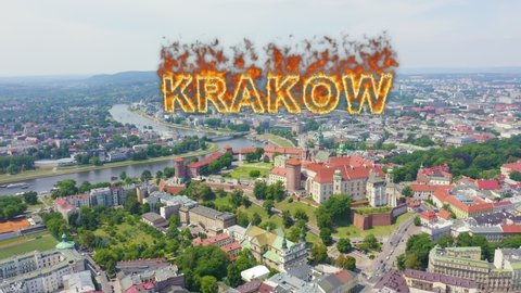 Inscription on video. Krakow, Poland. Wawel Castle. Ships on the Vistula River. View of the historic center. Name is burning, Aerial View, Point of interest