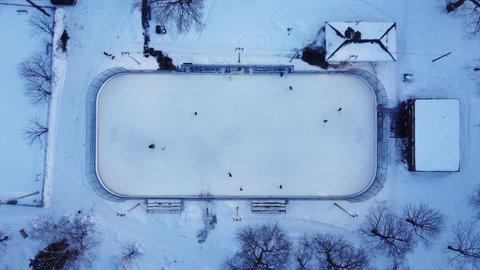 A top down zoom in view of an outdoor ice rink