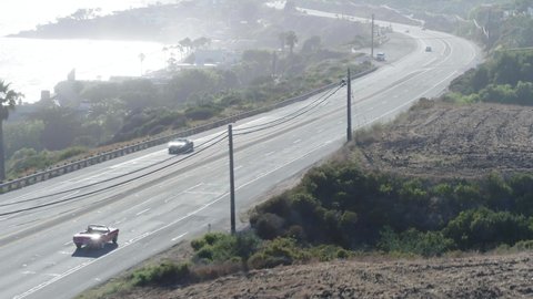 Aerial Forward Shot Of Cars Moving On Road During Sunny Day - Malibu, California