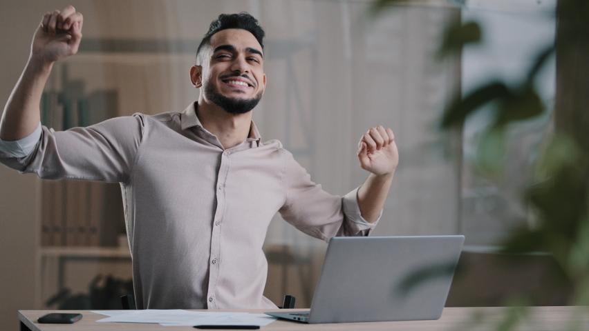 Amazed happy businessman hispanic guy worker winner dance at office emotional young man feel euphoric have fun celebrate monetary victory promotion salary growth get lot of money cash usd banknotes Royalty-Free Stock Footage #1089696849
