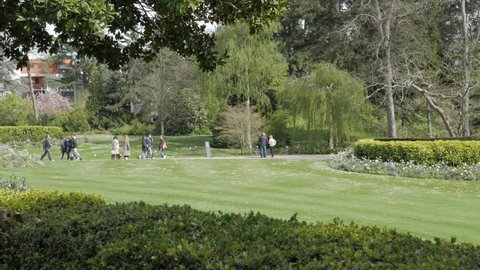 Nantes, France - April 10, 2022: People walking in a botanical garden Jardin des Plantes