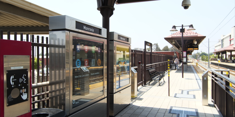 Panning A Metro Train Station Platform With Benches, Sign, And Ticket Machines - Los Angeles, California